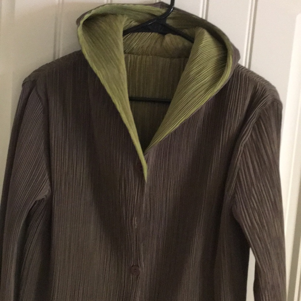 Hooded, fully reversible, knee length duster.